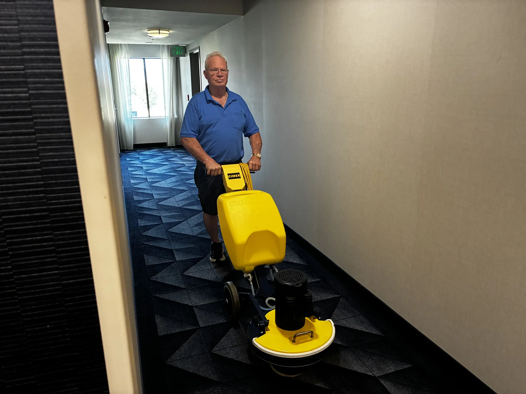 Great Western Carpet Care commercial carpet cleaning with Cimex machine in a business hallway